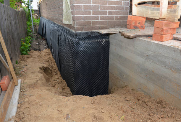 Happy homeowners after waterproofing job in Clay Center